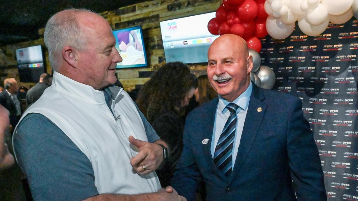 Fresno Mayor Jerry Dyer, right, greets Fresno State head football coach Jeff Tedford while he celebrates winning his second term during an election party at The Woodward American Grill in north Fresno on Tuesday, March 5, 2024.