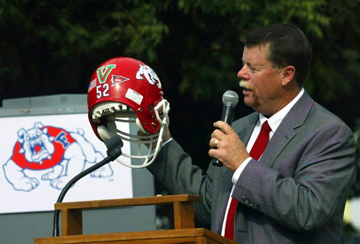 Former Fresno State football coach Pat Hill introduces the Green V helmet decal in this October 2003 photo.