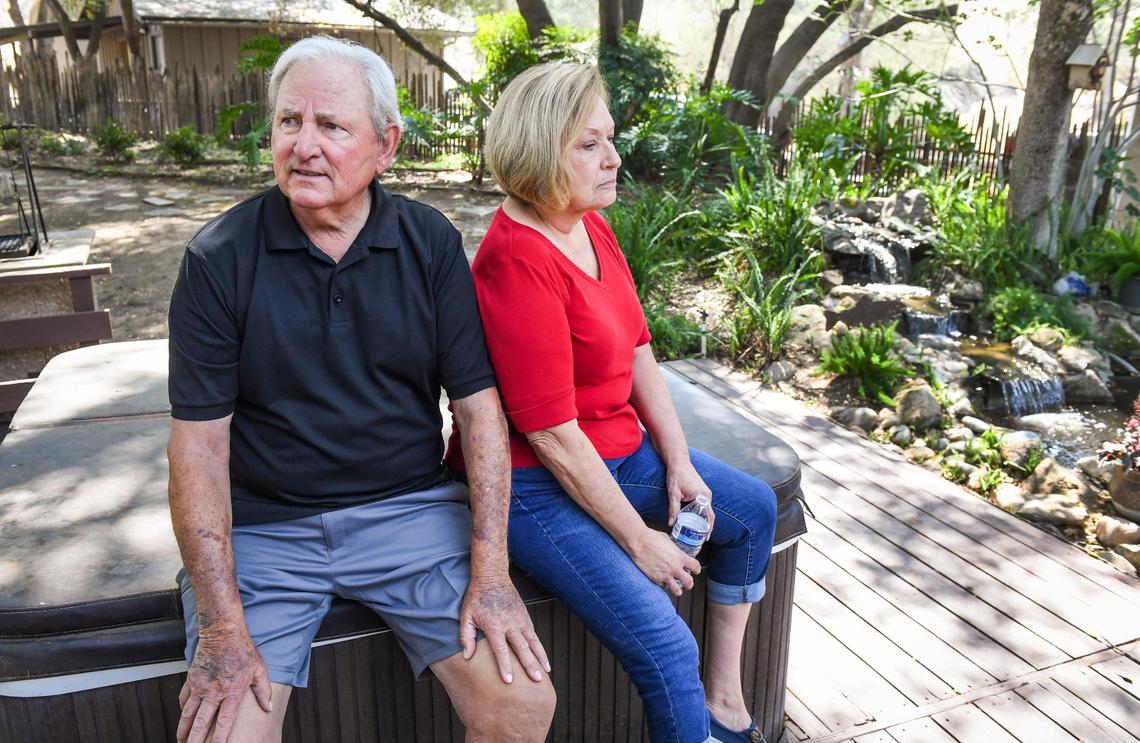 Dick and Diane Nichols sit in the backyard of their home in Prather on Wednesday, Aug. 25, 2021, a year after their former residence was destroyed in the Creek Fire. It was the second time in five years their home was destroyed by fire.