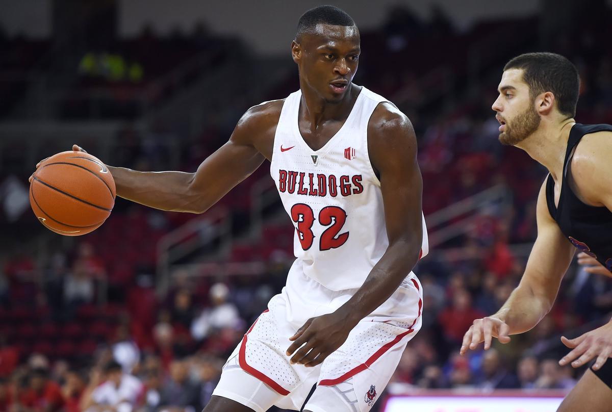 Fresno State forward Nate Grimes, left, had a career-game in the Bulldogs’ 82-70 victory over New Mexico at the Save Mart Center scoring 19 points with 19 rebounds including seven at the offensive end.