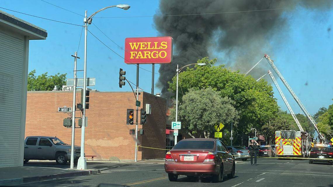 Fire crews battle large blaze at restaurant in downtown Visalia Sunday, May 1, 2022.