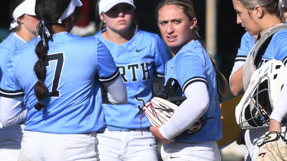 Clovis North pitcher Ryan Maddox, second from right, looks towards Clovis High between innings in the championship game of the Clovis Easter Classic softball tournament Monday, April 11, 2022 in Clovis. Clovis North won 7-0.