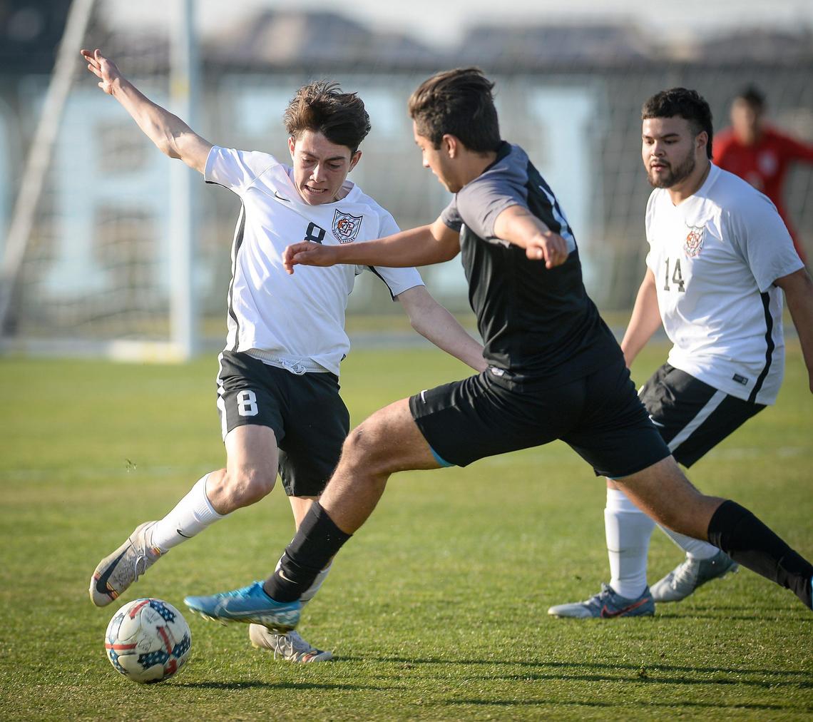 Central’s Noah Guillen, left, tries to steal the ball away from Clovis North’s Christian Silva in the first half of their Tri-River Athletic Conference match at Clovis North High on Tuesday, Feb. 4, 2020. Central’s Kaylob Walker scored the game’s only goal in the second half.
