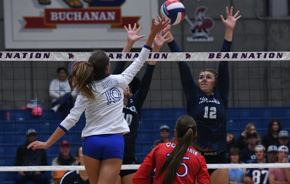 Buchanan’s Samantha Aaron, left, with Central Valley Christian’s Lola Highstreet, right, in the Central Section’s Division II girls volleyball championship Thursday, Nov. 3, 2022 in Clovis. The Bears won the fifth set to clinch a section title.