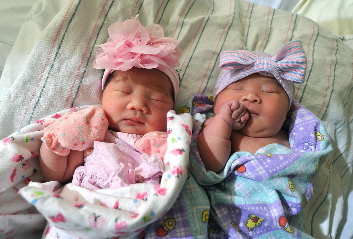 Cousins Candra Thao, left, Nadalie Xiong, rest on Monday morning, Nov. 5, 2018, at Community Regional Medical Center.