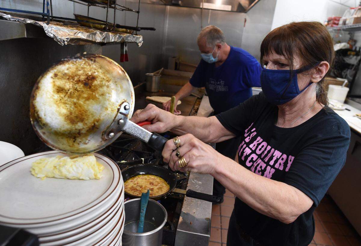 Lynda Wiens, daughter of the founder of the first BJ’s Kountry Kitchen, serves up eggs in this Fresno Bee file photo. The original restaurant opened at Cedar and Clinton avenues in the 1980s, but moved into the Save Mart shopping center at Cedar and Ashlan avenues shortly after in the 1980s. That location closed in October.
