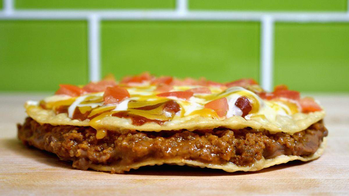 Taco Bell’s Mexican Pizza remains a popular item and is returning to menus permanently.