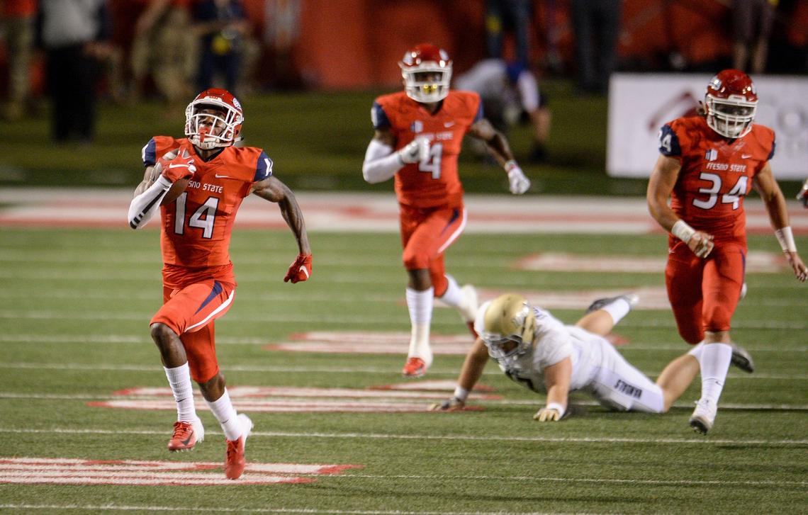 Fresno State cornerback Jaron Bryant, left, runs a blocked field goal back for a touchdown in a 79-13 rout of Idaho. Bryant, who led the Bulldogs with four interceptions last season, hasn’t been tested much yet this year. In a 27-3 victory over Wyoming, the Cowboys attempted only four passes in his direction.