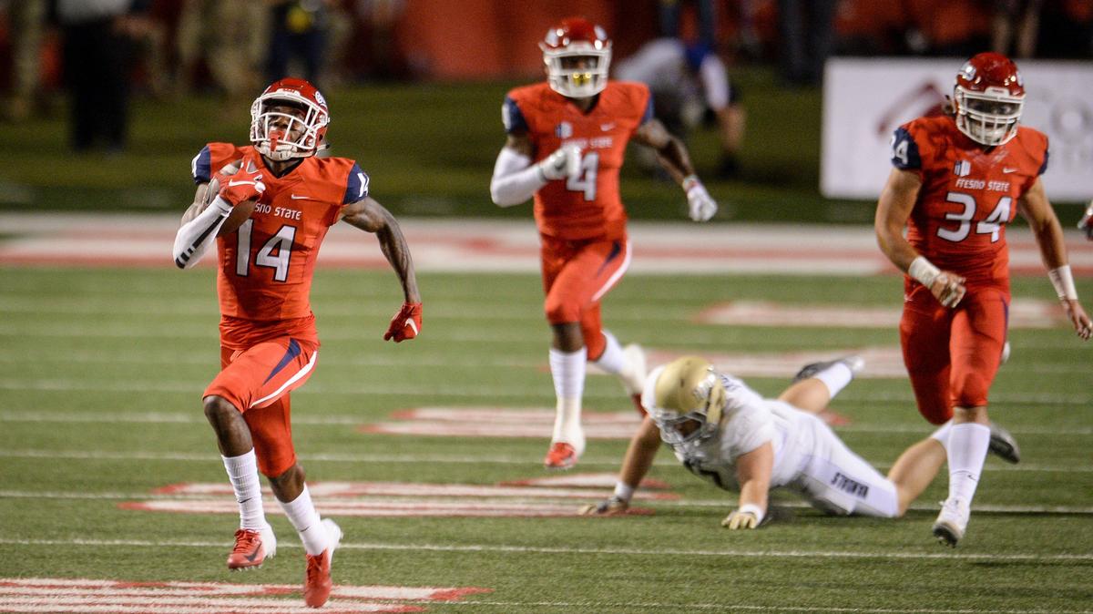 Fresno State cornerback Jaron Bryant, left, runs a blocked field goal back for a touchdown in a 79-13 rout of Idaho. Bryant, who led the Bulldogs with four interceptions last season, hasn’t been tested much yet this year. In a 27-3 victory over Wyoming, the Cowboys attempted only four passes in his direction.