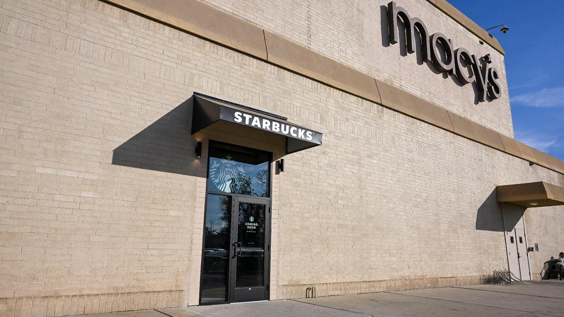 A door outside the Macy’s department store’s southern entrance at Fashion Fair mall shows that a new Starbucks coffee shop location will be opening soon.