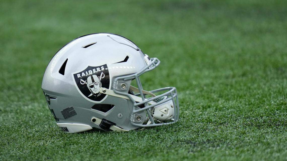 Las Vegas Raiders helmet on a turf.