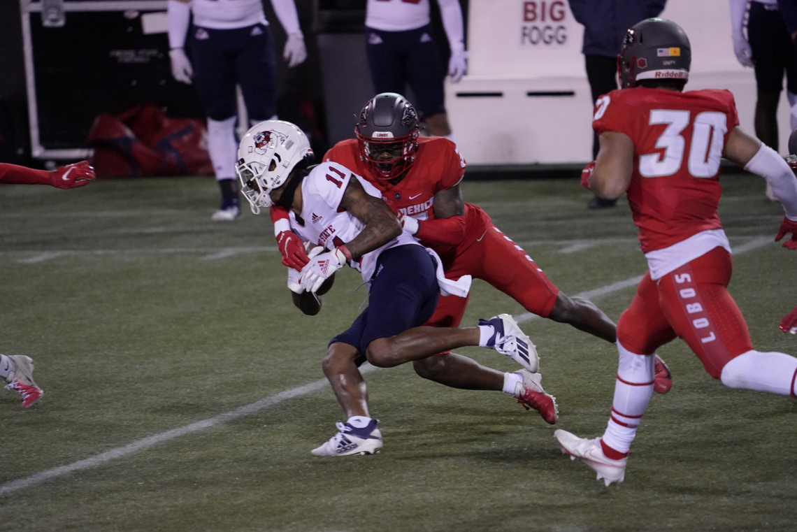 Fresno State wideout Josh Kelly is tackled after making a catch in the Bulldogs’ 49-39 loss to the New Mexico Lobos Saturday at Sam Boyd Stadium in Las Vegas. Kelly caught seven passes for 96 yards.