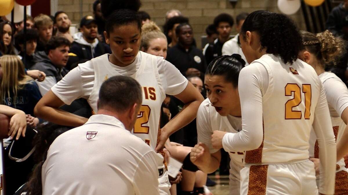 Clovis West girls basketball coach Craig Campbell talks to his players during a CIF Open Division regional semifinal game against St. Mary’s-Stockton on Saturday, March 2, 2024.