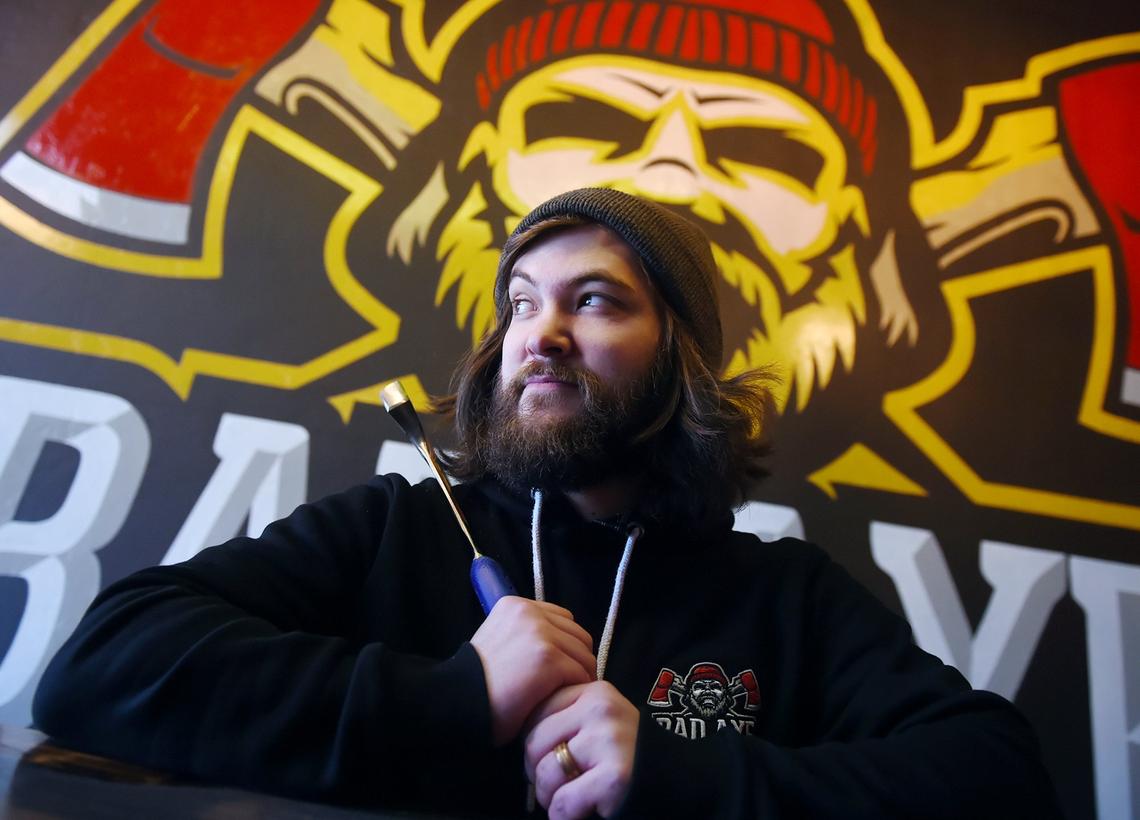 Kjai Block, Axe Master and operations manager for Bad Axe, shown at the new axe-throwing location for Bad Axe, located in the former Stevens Bicycles at Palm and Shields Avenues Tuesday, Feb. 6, 2019 in Fresno.