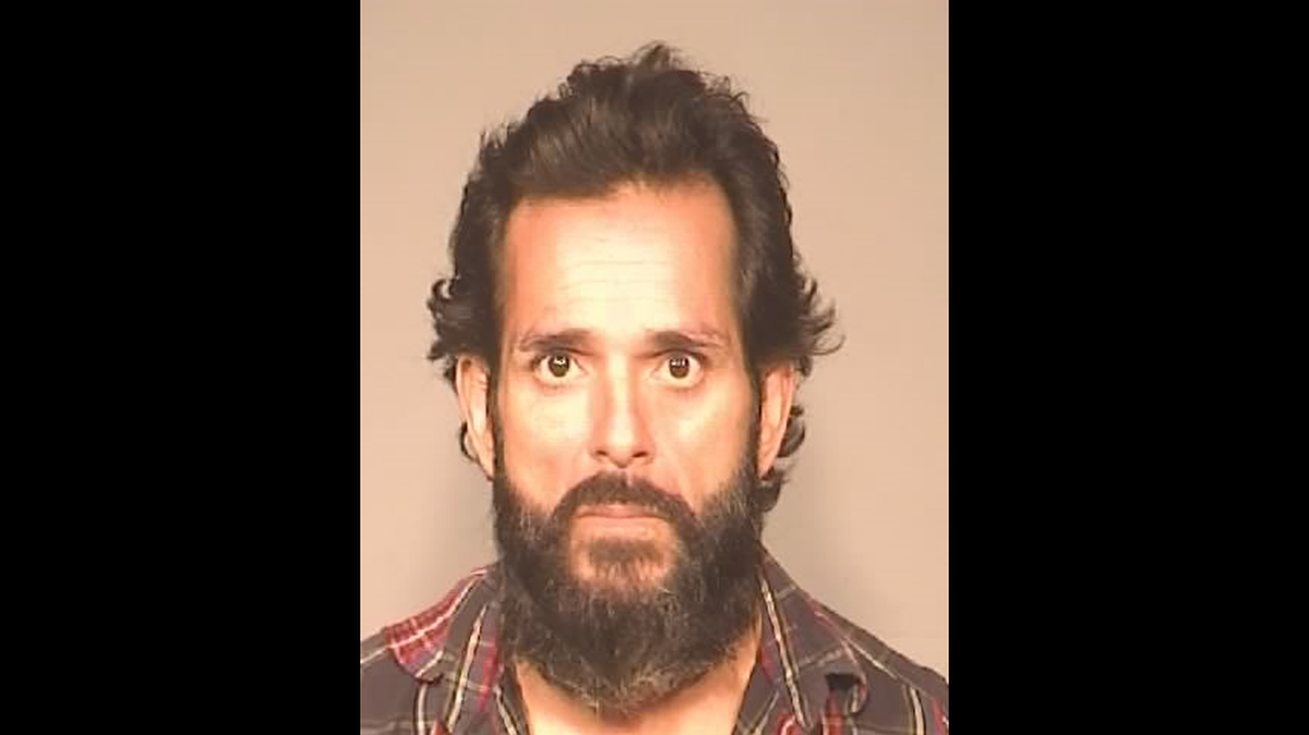 Christopher Martinez, 47, was booked into Fresno County Jail on attempted carjacking charges after a bizarre incident which unfolded Monday evening at Jensen Avenue and Highway 99.