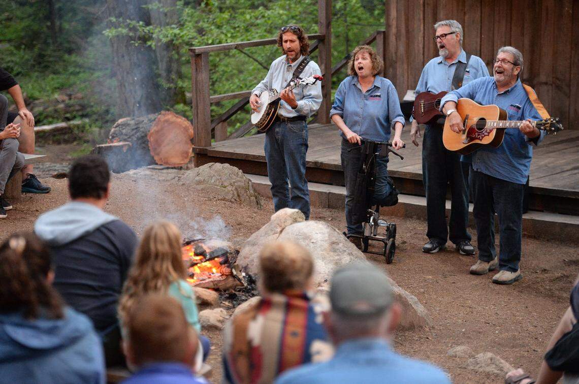 Members of the Sugar Pine Band perform during the midway break of a Yosemite Mountain Sugar Pine Railroad “moonlight special” excursion through the Sierra National Forest on Wednesday, June 6, 2019. 