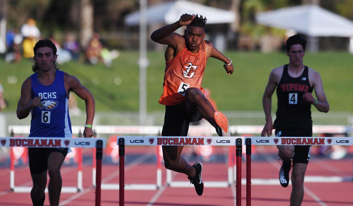 Central’s Noel Felix, center, runs in the 300 hurdles with a time of 39.65 at the Central Section Masters held at Buchanan High School Saturday, May 21, 2022 in Clovis.