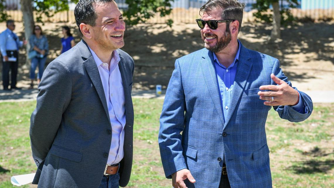 California Assemblyman Joaquin Arambula (D-Fresno), right, and Assembly Speaker Anthony Rendon (D-Los Angeles) chat during a press conference at Spano Park in Fresno on Tuesday, June 22, 2021.