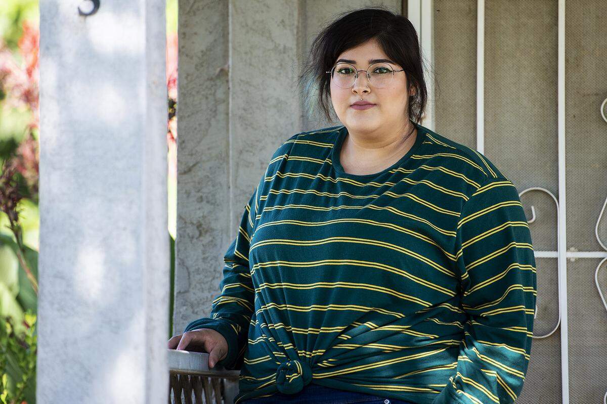 Nancy Valladolid, 24, poses for a portrait outside her home in Merced County, Calif., on Wednesday, July 29, 2020.