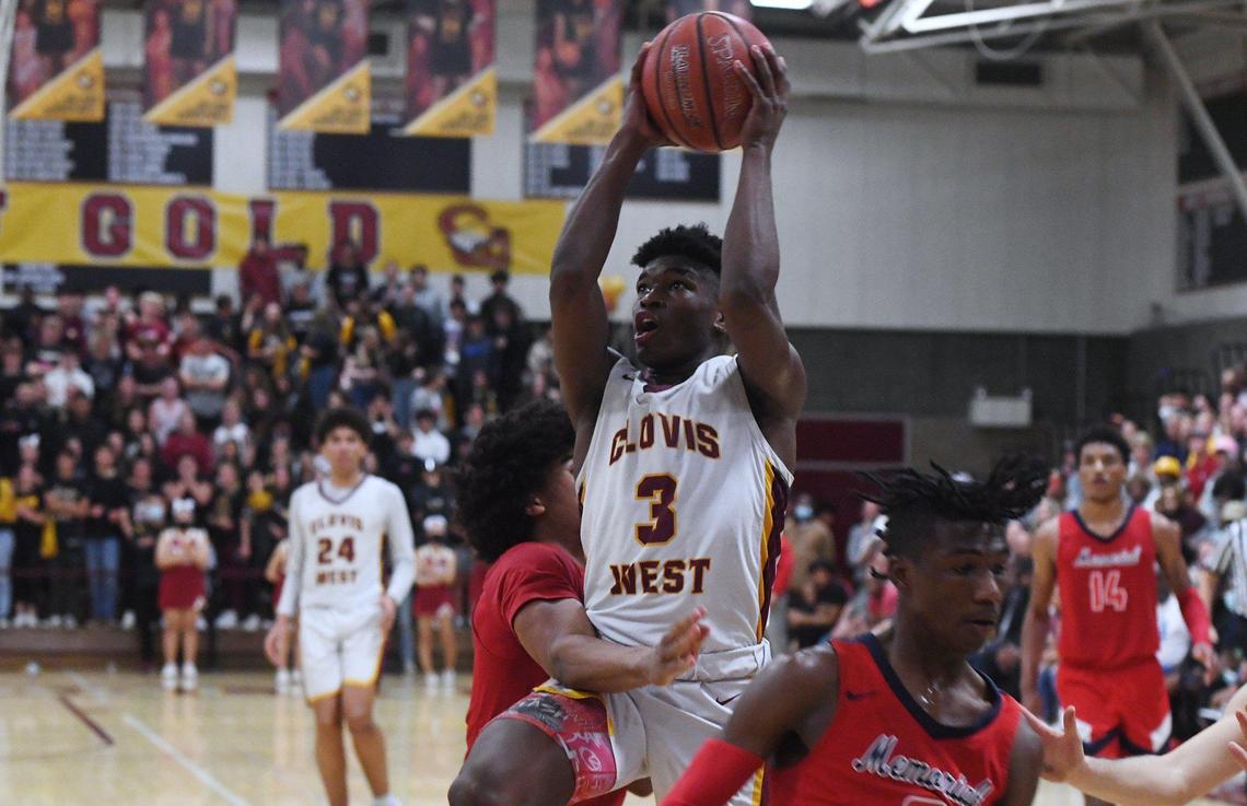 Clovis West’s Marshel Sanders runs up against San Joaquin Memorial’s defense in Open Division action Saturday, Feb. 19, 2022 in Fresno. Clovis West defeated San Joaquin Memorial 83-69.