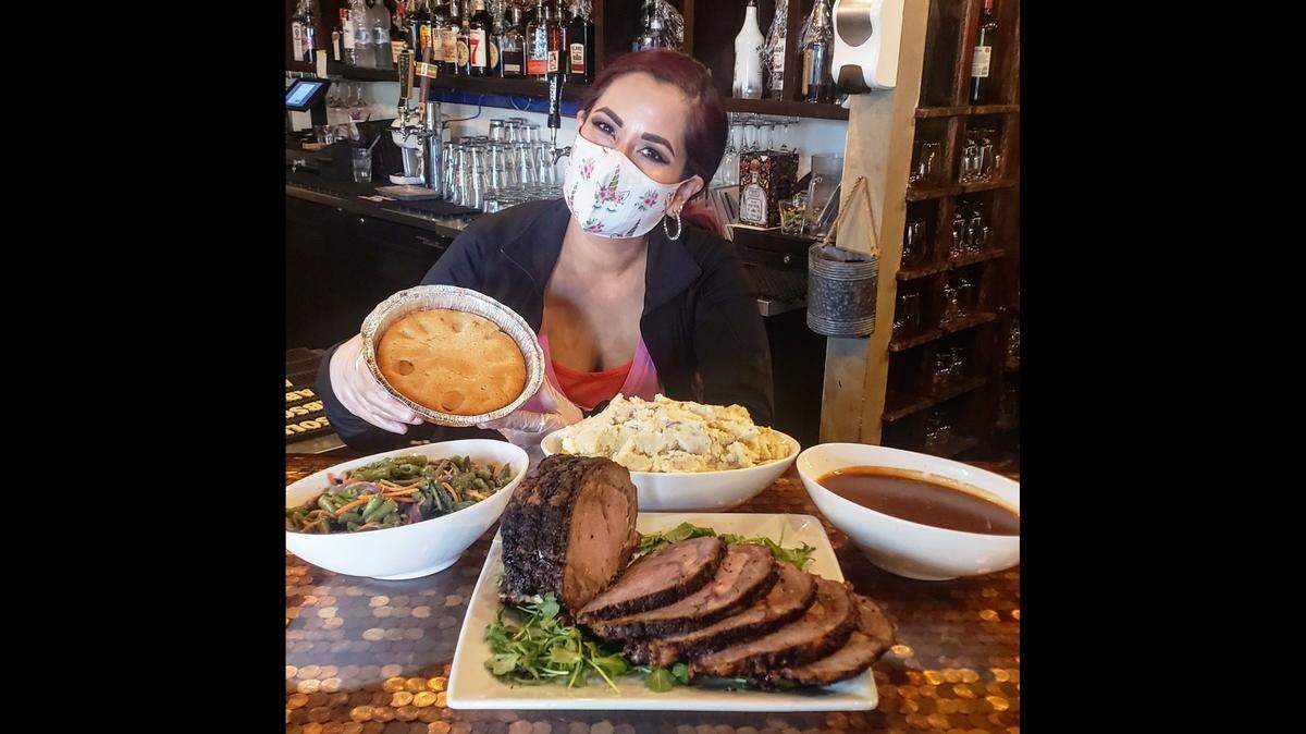 The Lincoln Pub & Grub in the Tower District is selling holiday take-home meals like this prime rib dinner with green beans, mashed potatoes and pie.