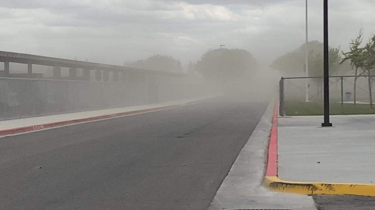 Dust kicks up after a storm system rolled into Fresno, California on Saturday, April 13, 2024.