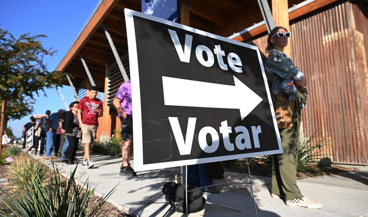 A long line of voters wait outside the Clovis Transit Center Tuesday, Nov. 4, 2025 in Clovis.