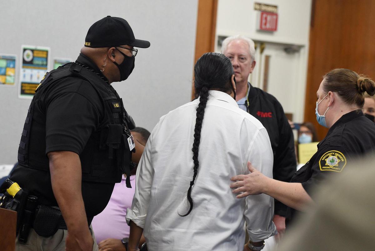 After turning his back on the Fresno County Board of Supervisors while he was speaking in favor of renaming Squaw Valley, Roman Raintree, Tribal Liaison for Seats of Sovereignty, is removed by security as requested by the board, Nov. 16, 2021.