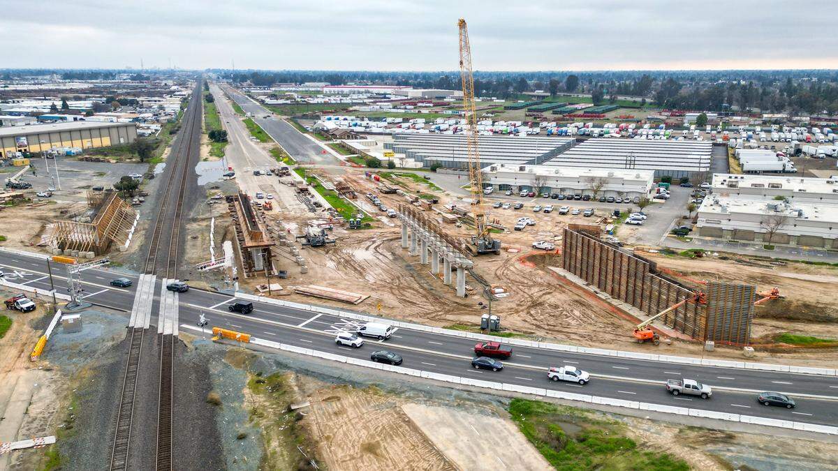 Traffic diverted around a detour at Shaw Avenue and Golden State in Fresno as construction on the California High-Speed Rail overpass gets underway on Monday, Dec. 29, 2025.