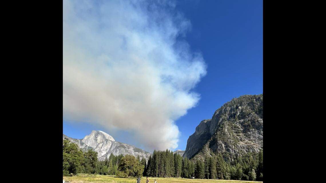 A plume of smoke rises from the Red Fire on Tuesday, Aug. 30, 2022, in the area of Yosemite National Park.