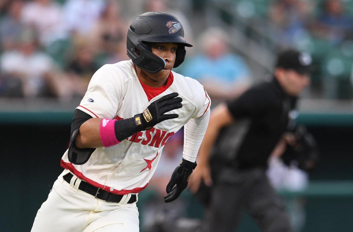 Fresno Grizzlies infielder Juan Brito doubles in the first inning of the season opener against the Stockton Ports Friday, April 8, 2022 at Chukchansi Park in Fresno. The Grizzlies saved the best for last, winning 5-4 on Zach Kokoska’s walkoff hit in the ninth to delight a crowd of 9,206.