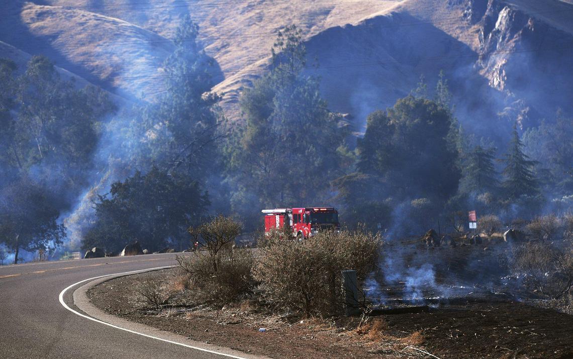 Cal Fire crews responded to a brush fire burning near Elwood Road and Piedra along the Kings River on Sunday, July 4, 2021.
