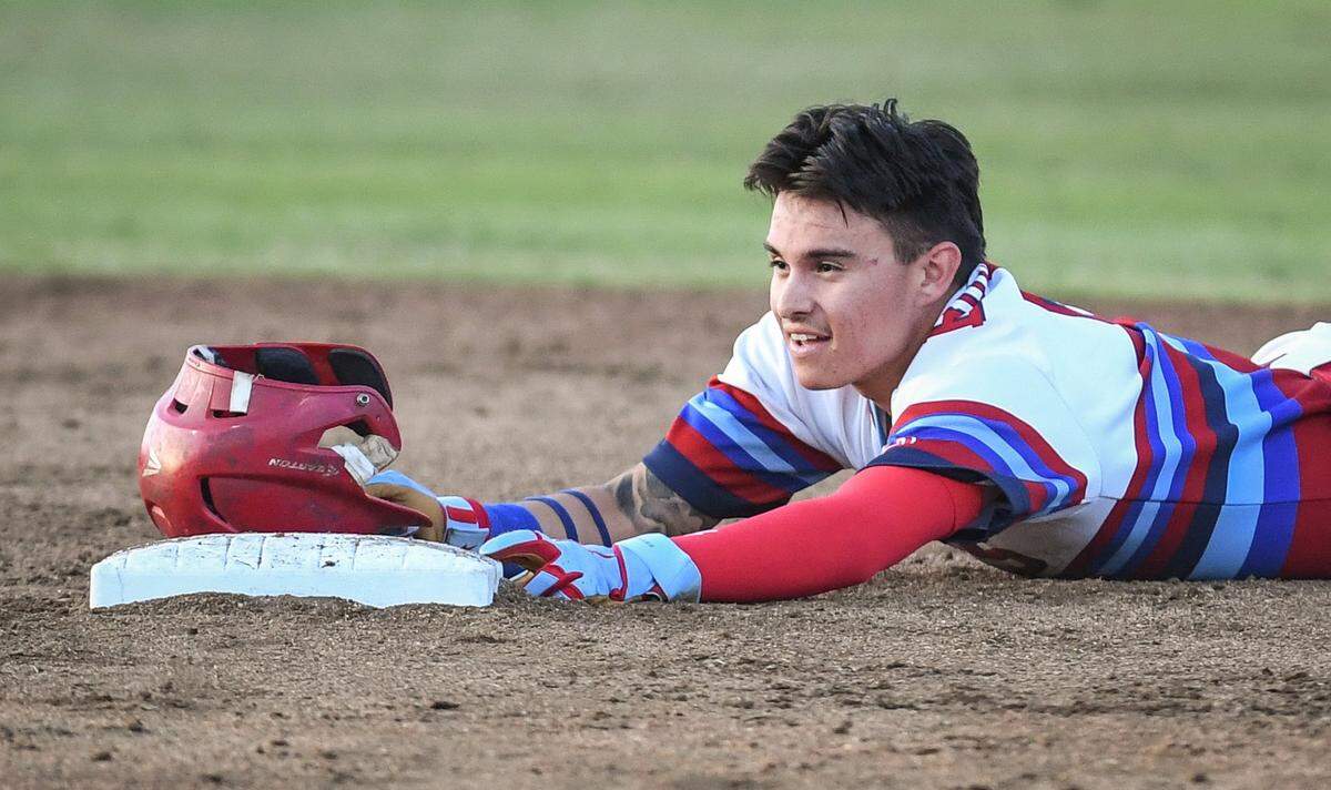 Buchanan’s Max Bernal lies in the dirt at second base after being tagged out while trying to extend a hit into a double against Central High in their game at Buchanan on Friday, April 29, 2022.