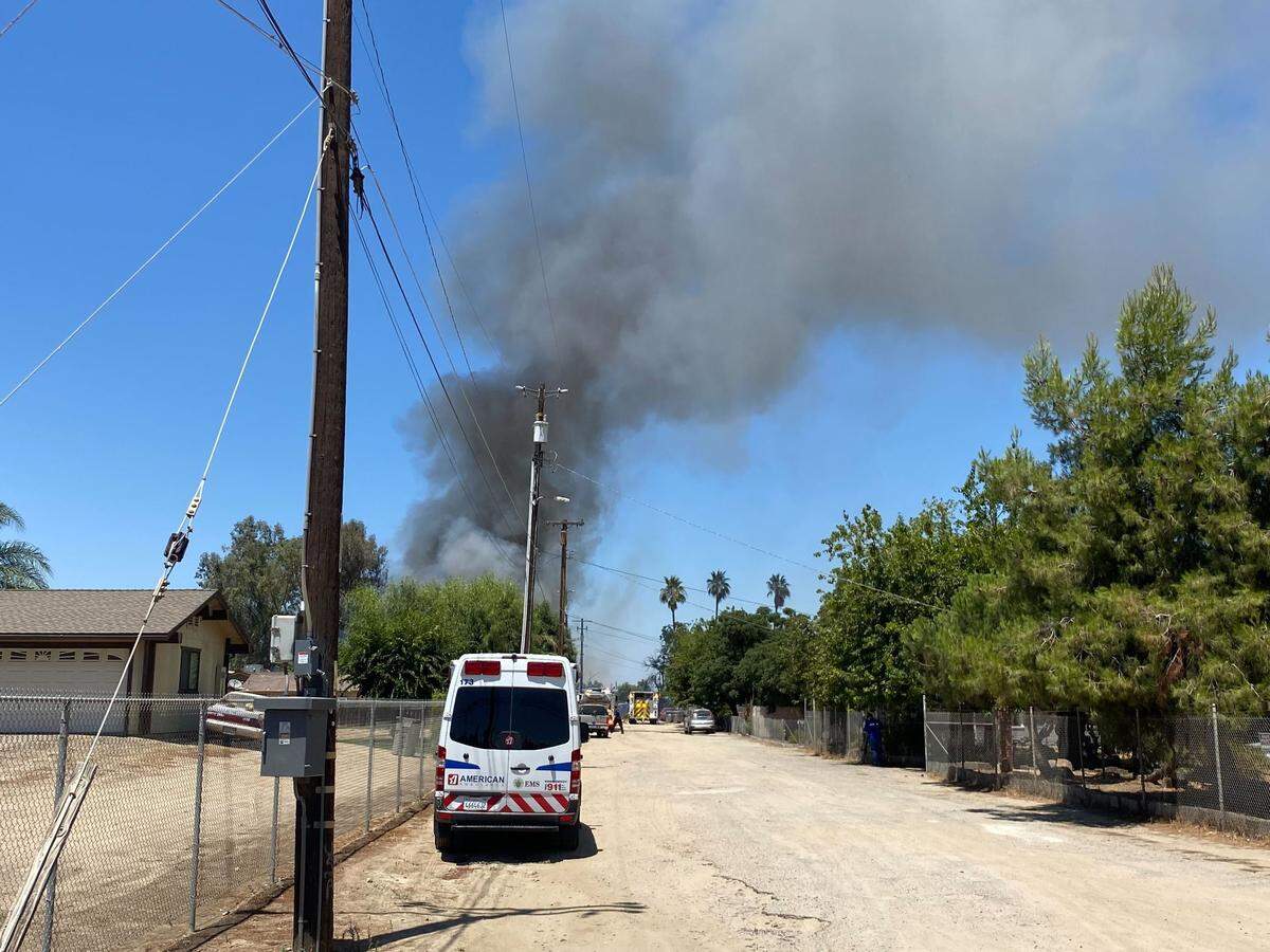 A plume of smoke can be seen in Fresno, California, on Monday, July 11, 2022.