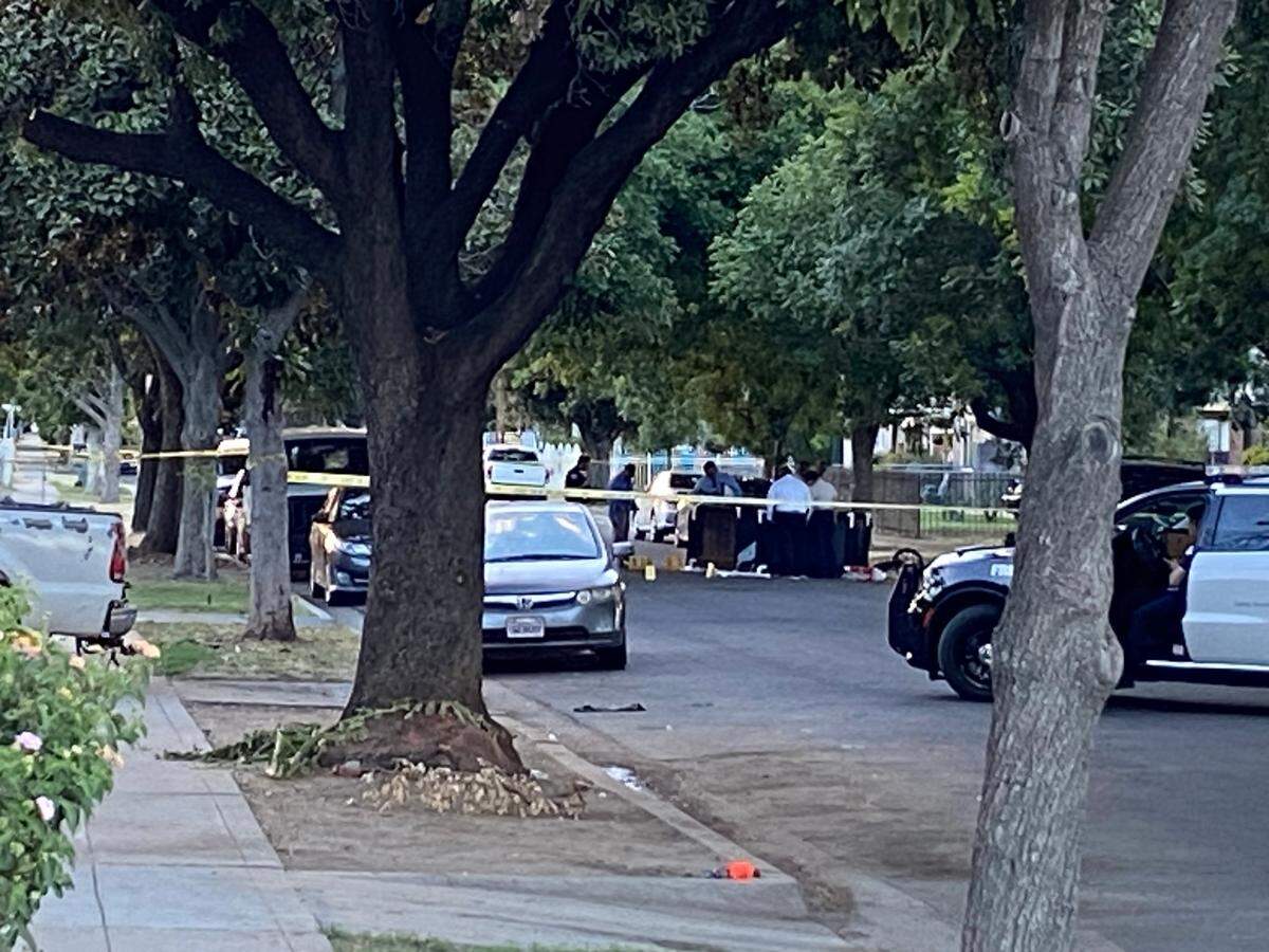 Fresno police investigate the scene of a fatal shooting on Grant Avenue near Belmont Avenue on Tuesday, July 25, 2023.