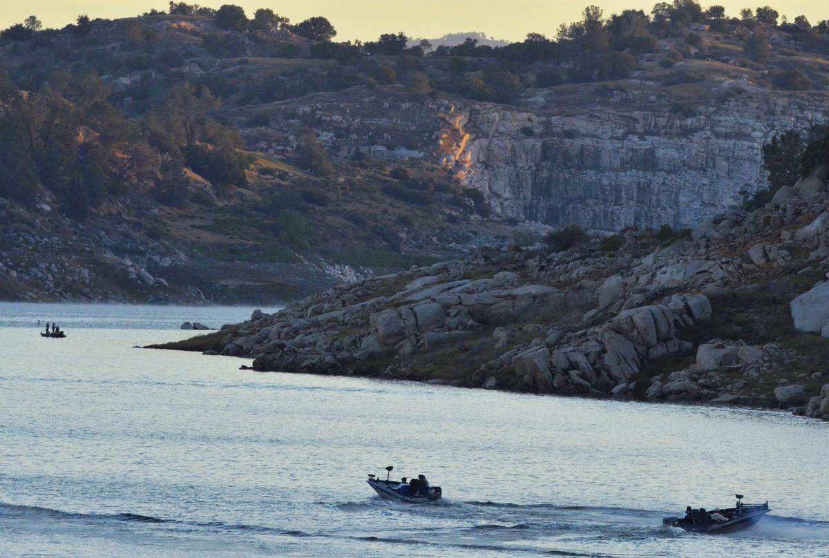 Two of nine boats head out at dawn with the Roosevelt High School team and students from other schools as they conduct a bass fishing tournament at Eastman Lake Sunday morning, April 14, 2013.