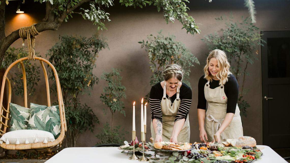 Kellie Hasson and Allison Cassabon, owners of Fig & Honey Lavish Grazing, have been operating as a catering company offering charcuterie boards and plan to open a wine and cheese bar in downtown Fresno’s historic T.W. Patterson building.