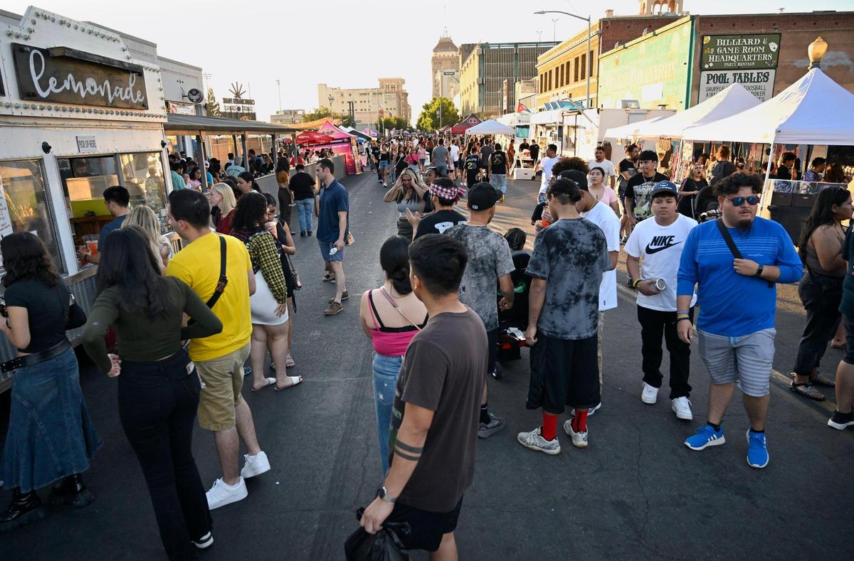 Thousands descend on Fulton Street as food vendors join clothing vendors and more during ArtHop, Thursday, Aug. 3, 2023 in downtown Fresno. Over time ArtHop has developed into much more than art gallery exhibits. 