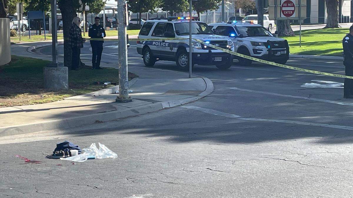Fresno police and airport workers on the scene of a vehicle vs. pedestrian crash in front of Fresno Yosemite International Airport Saturday morning, Oct. 14, 2023.