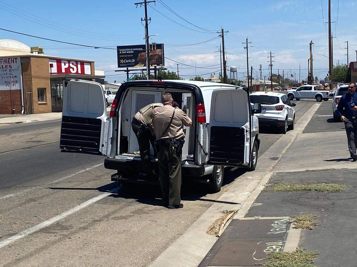 A suspect who had escaped police custody at the county jail in downtown Fresno, California, on Thursday, July 21, 2022, is loaded into a police van after he was re-captured.