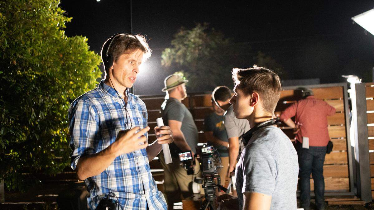 Directors Travis Cluff and Chris Lofing on the set of their latest film “Held.” The movie opens in theaters and on demand and streaming April 9.