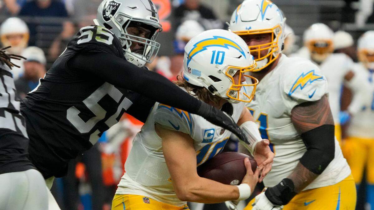 Las Vegas Raiders defensive end Chandler Jones pressures Los Angeles Chargers quarterback Justin Herbert during the first half of an NFL game, Sunday, Dec. 4, 2022, in Las Vegas.