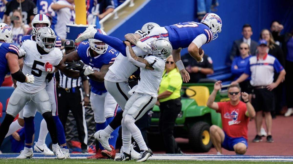 Josh Allen is tackled by Maxx Crosby and Marcus Epps on Sunday, Sept. 17, 2023.