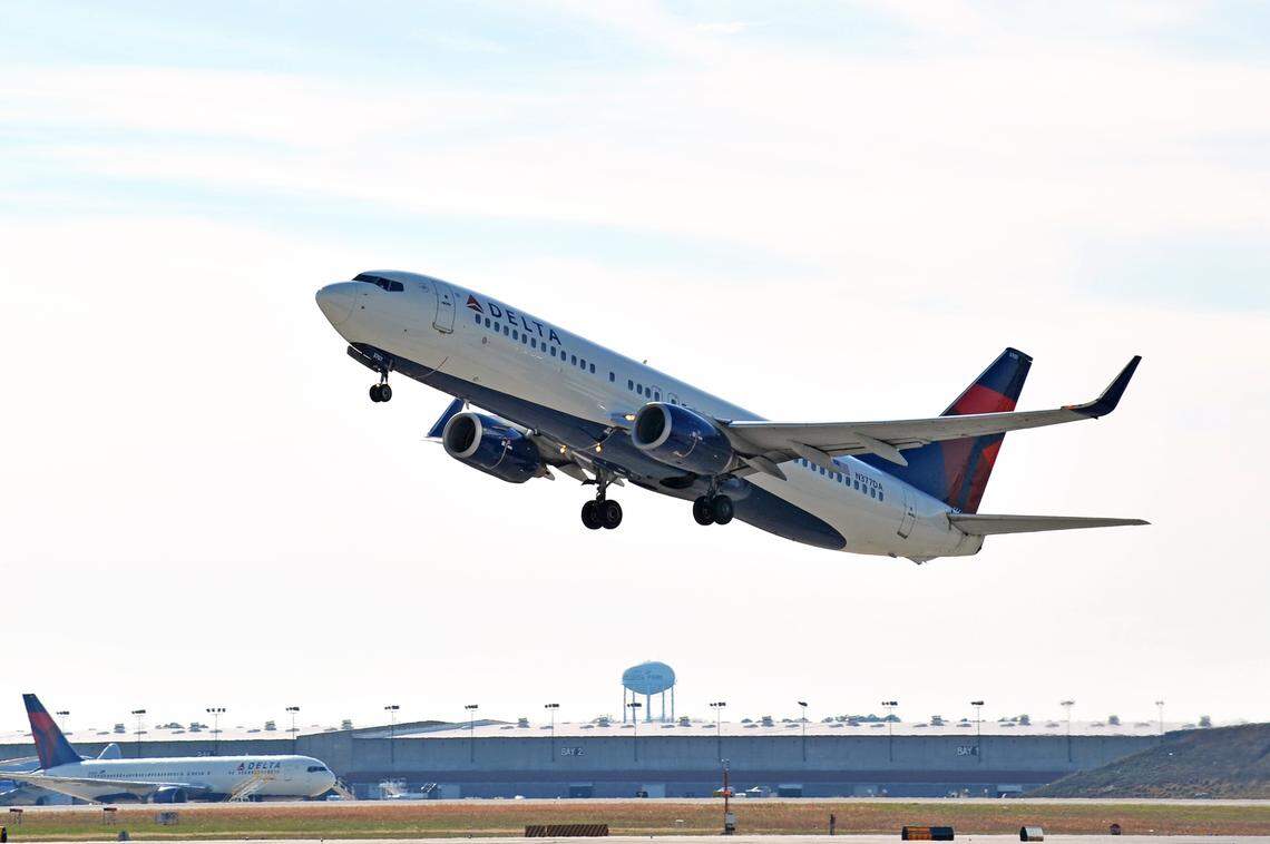 A Delta Air Lines Boeing 737-800 is shown on takeoff.