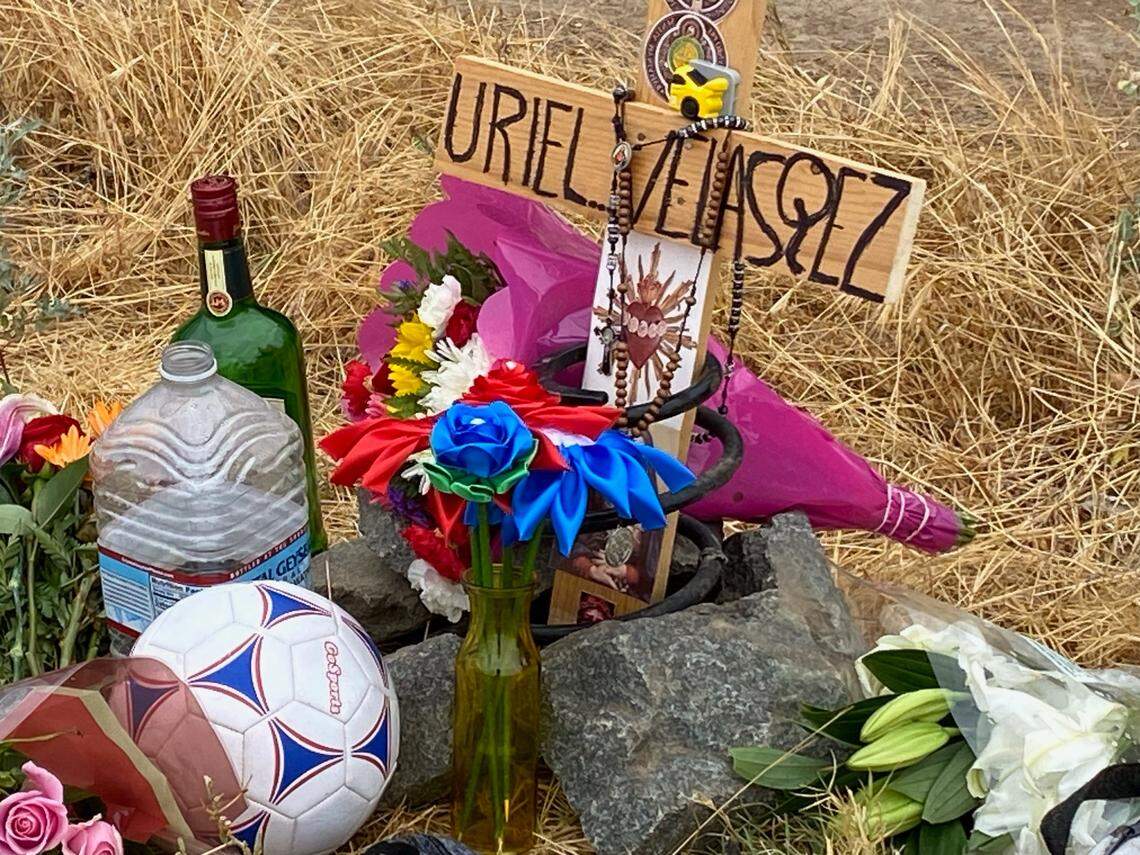 A shrine is placed at Highway 180 and McCall Avenue after former Sanger High soccer player Uriel Velasquez was killed in a collision on Saturday, Aug. 19, 2023.