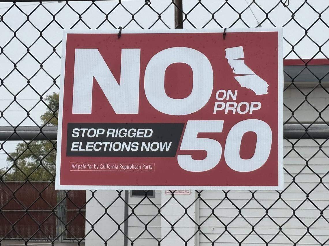 A No on Proposition 50 sign posted in front of a business in Kings County on Tuesday, Oct. 14, 2025. California’s Proposition 50 is a Nov. 4 special election ballot measure that authorizes the state legislature to temporarily redraw the state’s congressional district maps in response to partisan redistricting efforts in other states, primarily Texas.