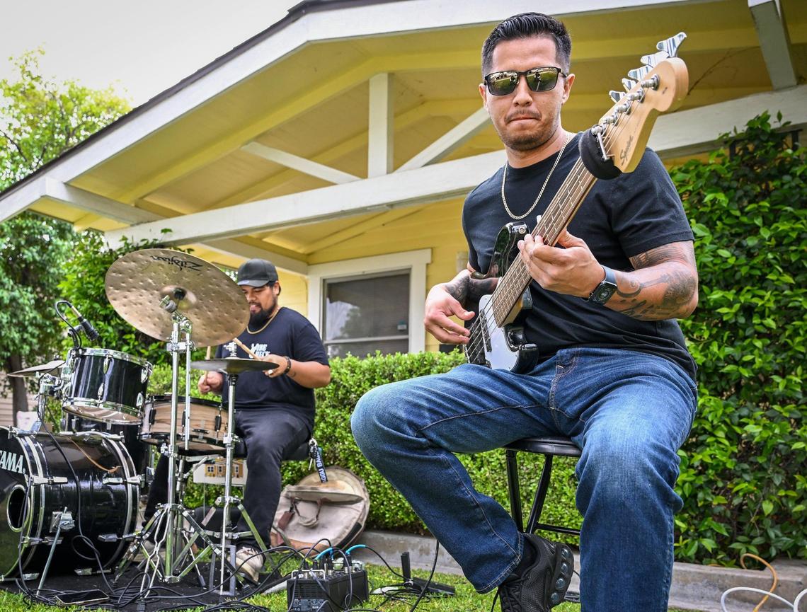 Vibe Check’s Marco Flores and Gene Abella perform with band members during a rehearsal in front of a home in Fresno’s Tower District in preparation for this year’s Tower Porchfest, on Thursday, April 17, 2025.
