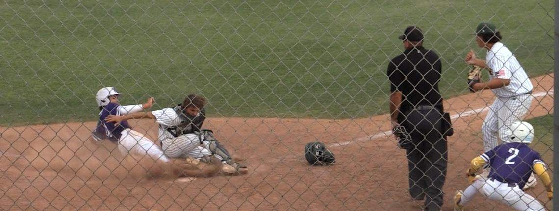 Davin Finderup of Washington Union slides home against Kingsburg in a Central Section Division II semifinal game. He was called out.