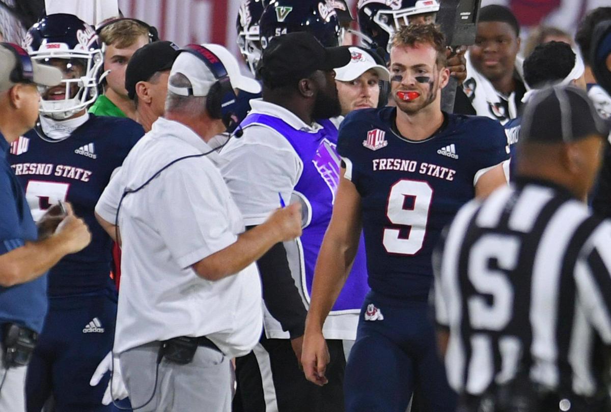 Fresno State head coachJeff Tedford, left, with quarterback Jake Haener, right, seen on the sidelines against San Diego State Saturday, Oct. 29, 2022 in Fresno.