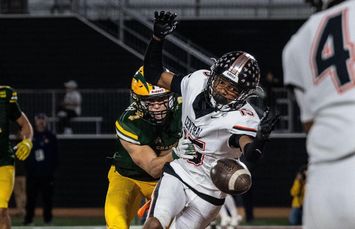The Central Grizzlies’ Xavior Jones (15) misses a catch in the end zone as he’s defended by the Edison Chargers’ Gavin Slaughter (7) during the CIF State Division 1-A championship at Saddleback College in Mission Viejo on Saturday.